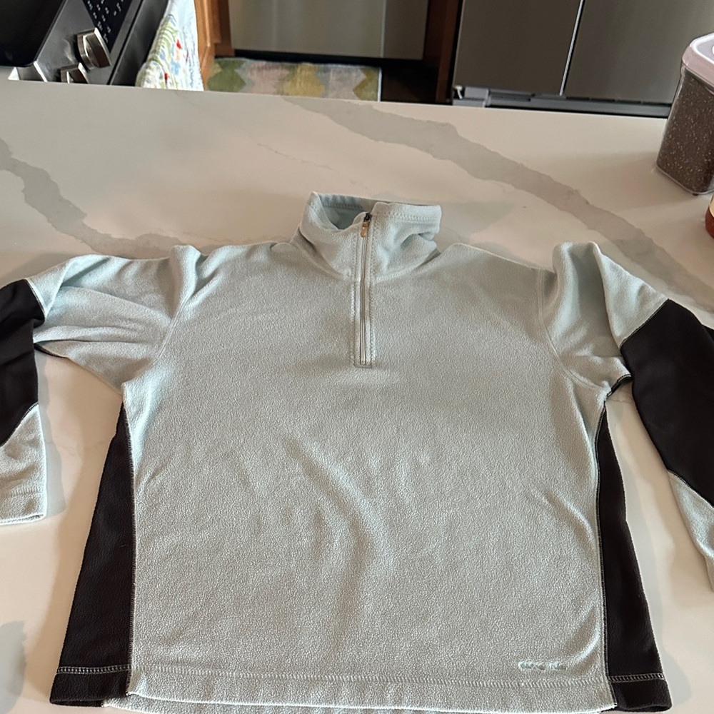 Woman’s  Light Blue and Black Patagonia fleece Sweater